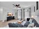Comfortable living room features a gray sectional sofa, modern decor, and plenty of natural light at 240 W Juniper Ave # 1020, Gilbert, AZ 85233