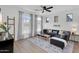 Cozy living room features a comfortable sectional sofa, modern decor, and large bright windows at 240 W Juniper Ave # 1020, Gilbert, AZ 85233