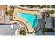 Overhead shot of a clean community pool with lounge chairs and manicured landscaping around the deck at 240 W Juniper Ave # 1020, Gilbert, AZ 85233
