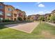 Sand volleyball court surrounded by a community of multi-story townhomes, perfect for recreational activities at 240 W Juniper Ave # 1020, Gilbert, AZ 85233