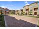 Sand volleyball court surrounded by lush green lawns, mature trees, and well-maintained residential buildings at 240 W Juniper Ave # 1020, Gilbert, AZ 85233
