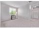 Minimalist bedroom with carpet, a window, and a black console at 2625 S Peppertree Dr # 101, Gilbert, AZ 85295