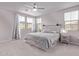 A relaxing bedroom with a queen-sized bed, neutral tones, and a ceiling fan at 2625 S Peppertree Dr # 101, Gilbert, AZ 85295