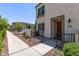 Front entrance view of a townhome with brick pavers and landscaping at 2625 S Peppertree Dr # 101, Gilbert, AZ 85295