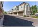 Street view of townhomes with brown garages and stucco exteriors at 2625 S Peppertree Dr # 101, Gilbert, AZ 85295