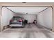 Spacious garage featuring an installed lift, allowing for easy storage of an automobile at 2625 S Peppertree Dr # 101, Gilbert, AZ 85295