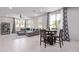 A bright and airy living room featuring modern decor with dining area adjacent at 2625 S Peppertree Dr # 101, Gilbert, AZ 85295