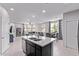 This open floor plan connects the living room, kitchen island and the dining area at 2625 S Peppertree Dr # 101, Gilbert, AZ 85295