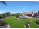 Beautiful backyard with a pool, patio, and well-manicured lawn perfect for outdoor entertaining and relaxing at 26647 N 43Rd N St, Cave Creek, AZ 85331