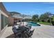 Backyard patio with dining furniture and outdoor living spaces overlooking pool, a perfect spot to relax at 26647 N 43Rd N St, Cave Creek, AZ 85331