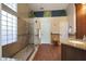 Bathroom featuring a glass-enclosed shower and granite countertops at 26647 N 43Rd N St, Cave Creek, AZ 85331