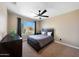 Neutral bedroom offers a ceiling fan, window views, carpet floors, and closet space at 26647 N 43Rd N St, Cave Creek, AZ 85331