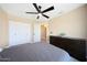 This bedroom features a ceiling fan and a closet at 26647 N 43Rd N St, Cave Creek, AZ 85331
