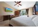Bedroom with ceiling fan and sliding glass door to the pool at 26647 N 43Rd N St, Cave Creek, AZ 85331