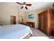 Bedroom with a ceiling fan and en-suite bathroom at 26647 N 43Rd N St, Cave Creek, AZ 85331
