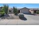 Charming single-story home with desert landscaping, spacious driveway, and attached two-car garage at 26647 N 43Rd N St, Cave Creek, AZ 85331