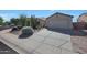 Charming desert home with xeriscaped front yard, mature cacti, and large driveway at 26647 N 43Rd N St, Cave Creek, AZ 85331