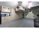 Spacious garage with storage cabinets and overhead racks, perfect for organization at 26647 N 43Rd N St, Cave Creek, AZ 85331