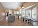 Eat-in kitchen boasts bright lighting, stainless appliances, light countertops and wooden floors at 26647 N 43Rd N St, Cave Creek, AZ 85331