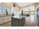Bright kitchen with granite countertops, stainless steel appliances, and open access to the living area at 26647 N 43Rd N St, Cave Creek, AZ 85331