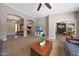 Open-concept living space featuring archways, neutral tones, and ample natural light at 26647 N 43Rd N St, Cave Creek, AZ 85331