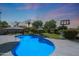 Inviting backyard pool with a basketball hoop, umbrellas, and desert landscaping at 26647 N 43Rd N St, Cave Creek, AZ 85331