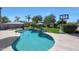 Inviting pool surrounded by a patio, mature trees, and a basketball court, perfect for outdoor recreation at 26647 N 43Rd N St, Cave Creek, AZ 85331