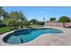 Backyard pool with volleyball net, basketball hoop and desert landscaping, perfect for outdoor fun at 26647 N 43Rd N St, Cave Creek, AZ 85331
