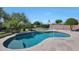 Inviting pool with a volleyball net and beautifully landscaped surroundings, perfect for outdoor fun and relaxation at 26647 N 43Rd N St, Cave Creek, AZ 85331