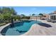 Inviting pool area with lush landscaping, seating, and shade, ideal for outdoor relaxation and fun at 26647 N 43Rd N St, Cave Creek, AZ 85331