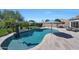 Inviting pool with a volleyball net and beautifully landscaped surroundings, perfect for outdoor fun and relaxation at 26647 N 43Rd N St, Cave Creek, AZ 85331