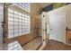 Beautiful walk-in shower with tiled walls, glass-block window and brushed nickel hardware at 26647 N 43Rd N St, Cave Creek, AZ 85331
