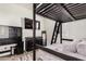 A bedroom with a bunkbed frame, mounted TV, and coordinating furniture at 2747 S 85Th Way, Mesa, AZ 85209