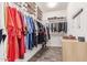 Walk-in closet with custom shelving, organized clothing racks, and tile floors at 2747 S 85Th Way, Mesa, AZ 85209