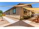 Attractive home exterior with decorative rock, planters, walkway, and shade awning at 2747 S 85Th Way, Mesa, AZ 85209