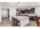 Spacious kitchen featuring a large island with seating, modern appliances, and ample cabinet space at 2747 S 85Th Way, Mesa, AZ 85209