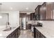 Well-equipped kitchen with granite countertops, stainless steel appliances, and stylish cabinetry at 2747 S 85Th Way, Mesa, AZ 85209