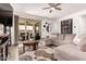 Cozy living room featuring a stylish rug, comfortable sectional sofa, and access to the outdoor patio at 2747 S 85Th Way, Mesa, AZ 85209