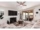 Comfortable living room with plush seating, modern decor, and a sliding glass door to the patio at 2747 S 85Th Way, Mesa, AZ 85209