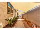 Landscaped side yard featuring walkway, plants, rock detail, and shade awning at 2747 S 85Th Way, Mesa, AZ 85209