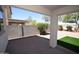 Wide-angle view of covered patio with desert landscaping and artificial turf at 28377 N Desert Native St, San Tan Valley, AZ 85143