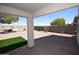 Covered patio with decorative rock, artificial turf, and desert landscaping at 28377 N Desert Native St, San Tan Valley, AZ 85143