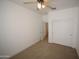 Neutral bedroom featuring carpet, a ceiling fan, and a sliding-door closet at 28377 N Desert Native St, San Tan Valley, AZ 85143