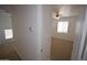 Upstairs hallway, with views to the bedroom, features neutral colors and carpet at 28377 N Desert Native St, San Tan Valley, AZ 85143