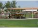 This community playground area features multiple play structures for to enjoy in a safe and engaging environment at 28377 N Desert Native St, San Tan Valley, AZ 85143