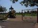 A playground area with swings and slides for to enjoy hours of active play and social interaction in the community at 28377 N Desert Native St, San Tan Valley, AZ 85143