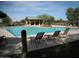 Community pool with lounge chairs and shaded ramada at 28377 N Desert Native St, San Tan Valley, AZ 85143