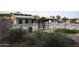 Community pool area with iron fence, lounge chairs, and landscaping at 28377 N Desert Native St, San Tan Valley, AZ 85143