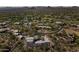 Expansive desert community features an estate home surrounded by green landscaping and desert views at 28729 N 107Th St, Scottsdale, AZ 85262