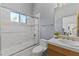 Bright bathroom featuring shower over tub and large vanity at 28729 N 107Th St, Scottsdale, AZ 85262